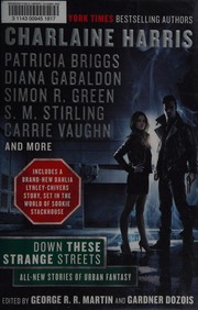 Front cover of Down these strange streets by George R. R. Martin