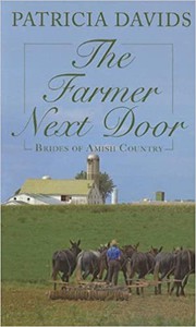 Front cover of The farmer next door by Patricia Davids