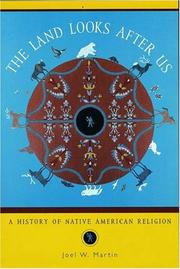 Front cover of The Land Looks After Us by Joel W. Martin