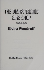 Front cover of The disappearing bike shop by Elvira Woodruff