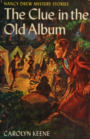 Front cover of The clue in the old album by Carolyn Keene