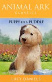 Front cover of Puppy in a Puddle (Animal Ark Classics #43) by Lucy Daniels