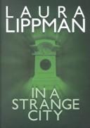 Front cover of In a strange city by Laura Lippman
