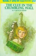 Front cover of The clue in the crumbling wall by Carolyn Keene