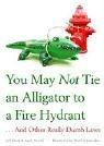 Front cover of YOU MAY NOT TIE AN ALLIGATOR TO A FIRE HYDRANT by ANDY POWELL, WARD SCHUMAKER (ILLUSTRATOR) JEFF KOON