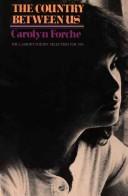 Front cover of The country between us by Carolyn Forché
