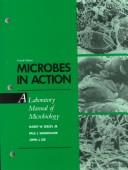 Cover of Microbes in action by Harry W. Seeley