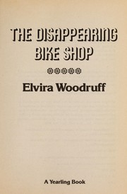 Front cover of The disappearing bike shop by Elvira Woodruff
