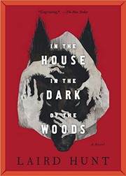 Front cover of In the house in the dark of the woods by Laird Hunt