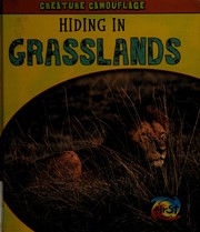 Front cover of Hiding in grasslands by Deborah Underwood